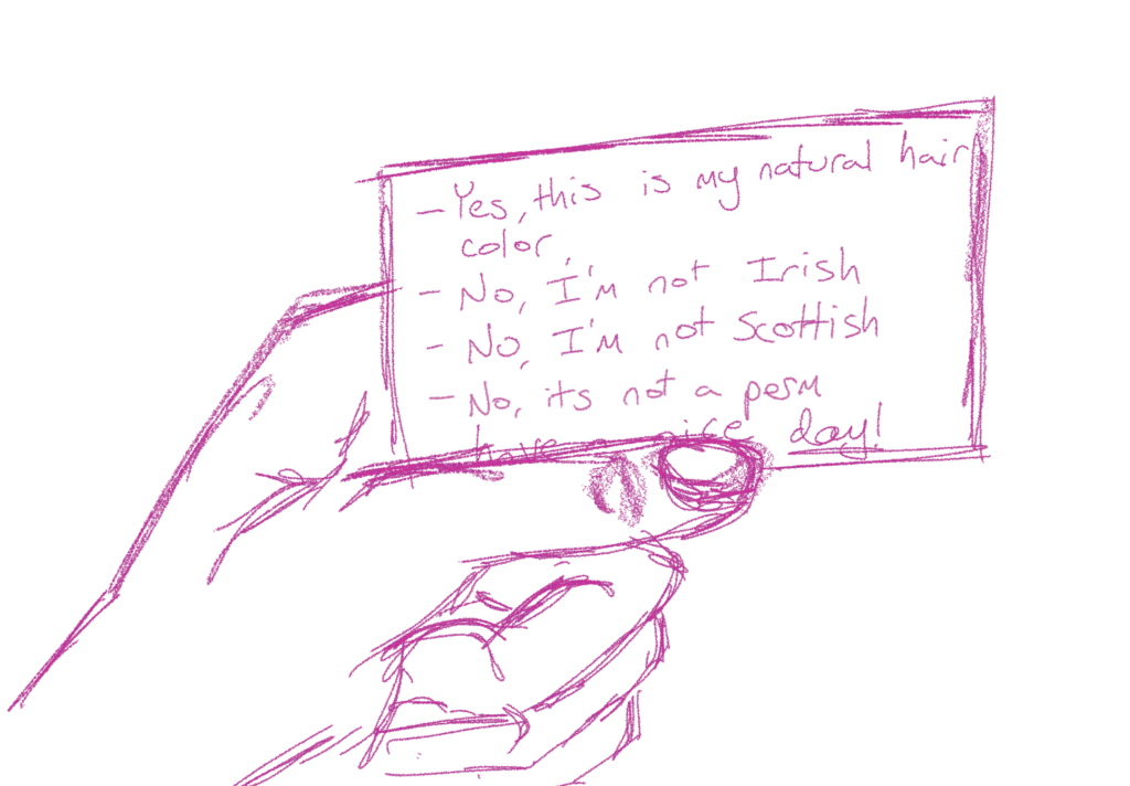 A hand holds a business card reading "-Yes, this is my natural hair color -No, I'm not Irish - No, I'm not Scottish - No, it's not a perm - Have a nice day!"
